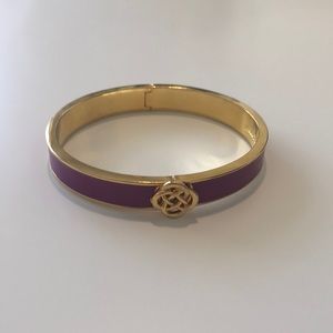 Gold and purple bangle.